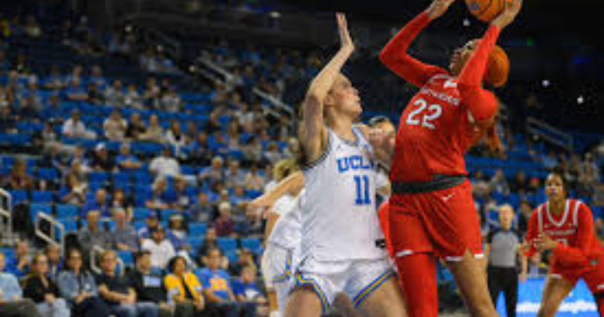 “Iowa players in action during a key victory that strengthens their conference momentum.”